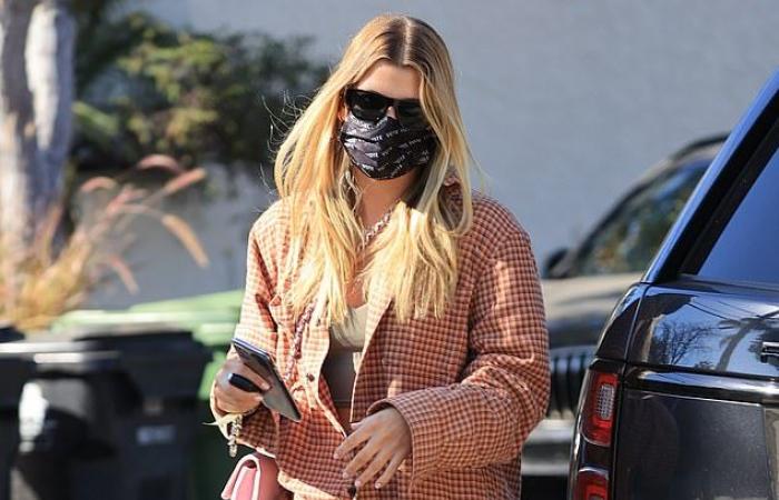 Sofia Richie rocks a plaid shirt while meeting a friend at...