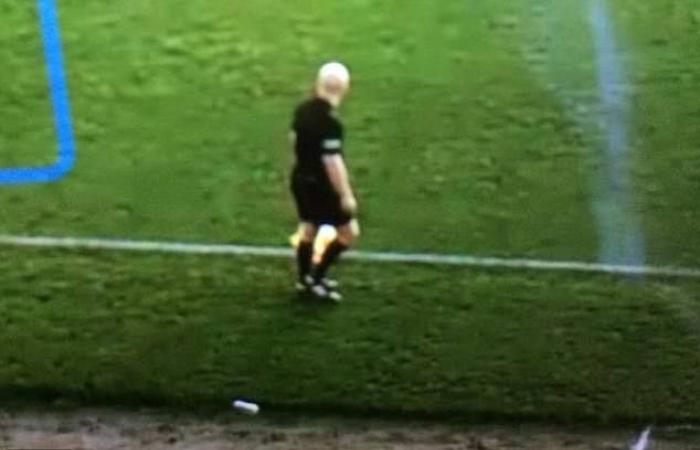 An artificial intelligence (AI) misses and detects a bald referee’s head...