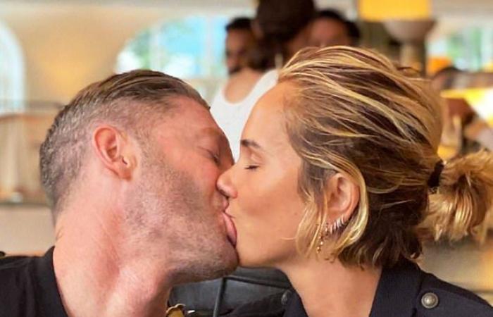 Pip Edwards and Michael Clarke lock their lips in the Sydney...