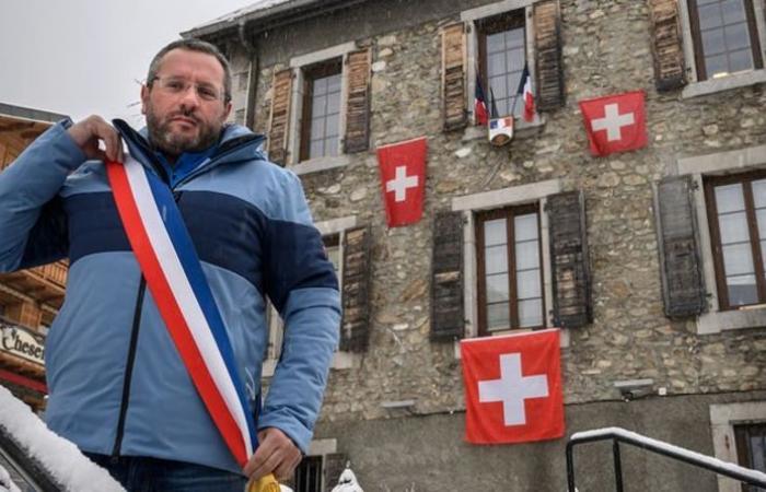 Emmanuel Macron: Swiss flags flying above the French city as residents...