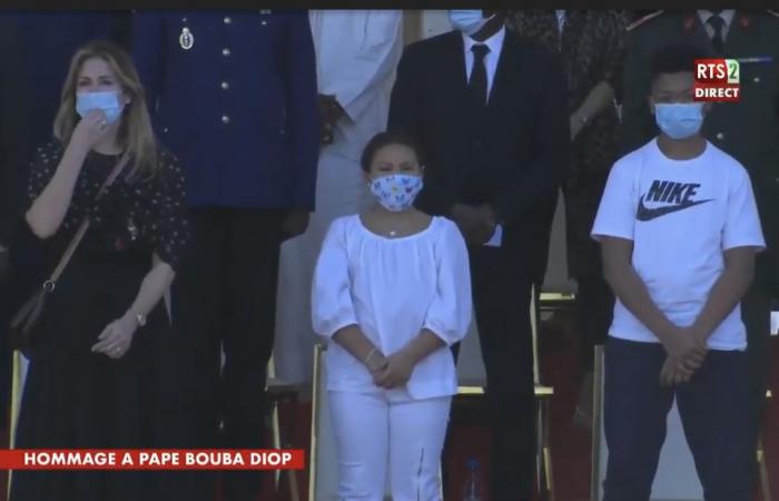 His widow Marie Aude and their children Aron and Awa alongside President Macky Sall.