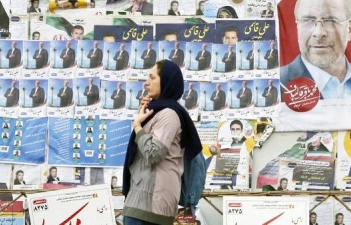 Iran elections: Record low turnout in polls as hard-liners win