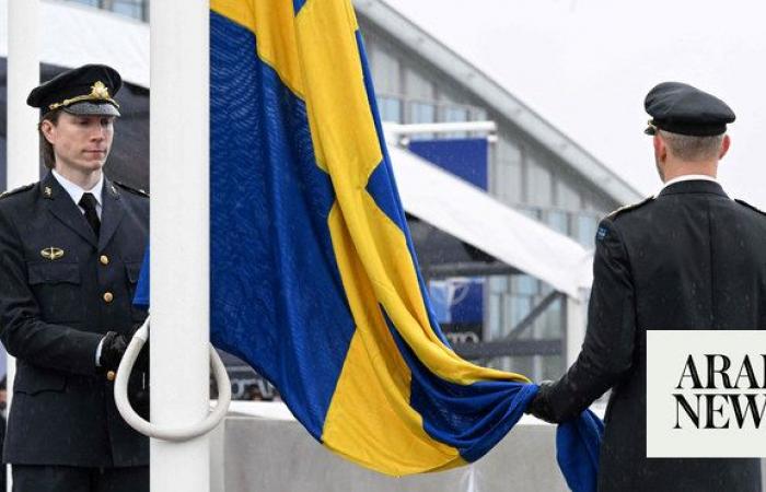 Sweden’s flag is raised at NATO headquarters to cement its place as the 32nd member of the alliance