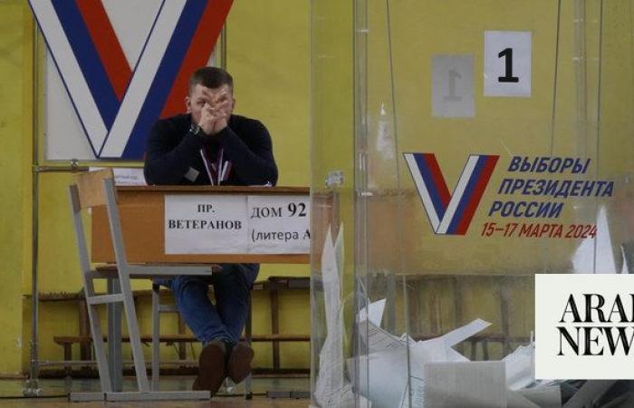Russians cast ballots in an election preordained to extend President Vladimir Putin’s rule