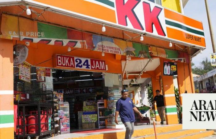Malaysian convenience store owners charged over ‘Allah’ socks that angered Muslims