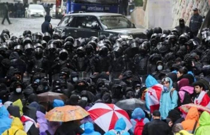 Riot police face off against demonstrators in Georgia