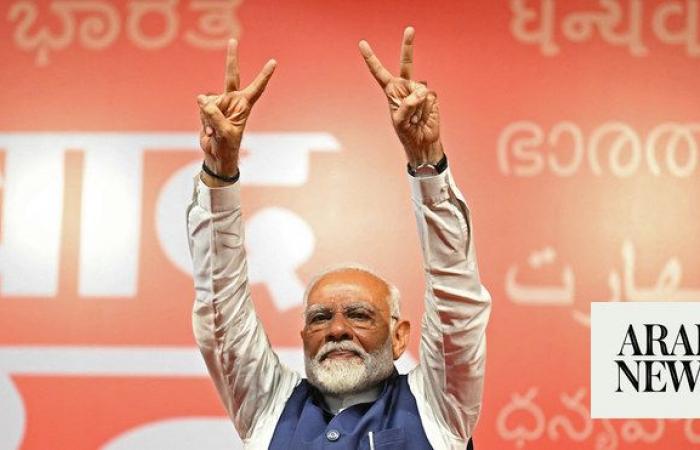 Modi celebrates bittersweet victory as BJP loses absolute majority