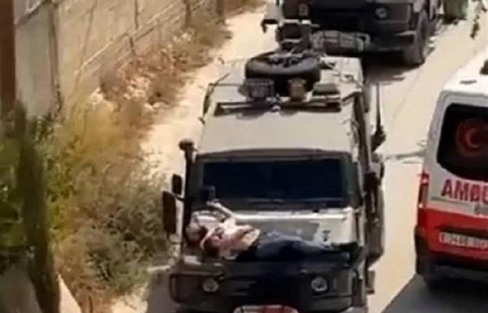 Israeli military straps injured Palestinian man to hood of jeep
