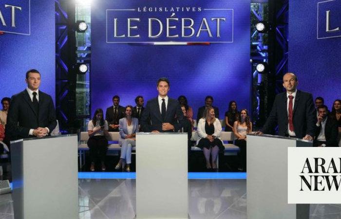 French PM, far-right chief cross swords in raucous election debate