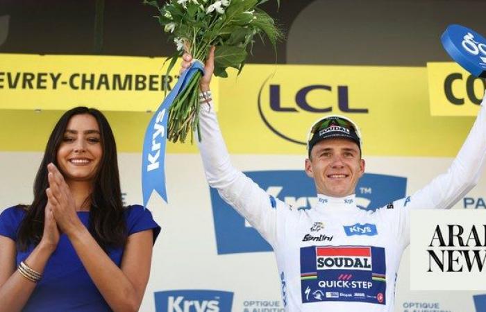 Evenepoel survives fright to win time trial as Pogacar holds lead