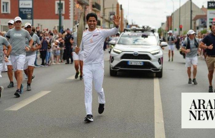 ‘An achievement for all Arabs’: PSG President Nasser Al-Khelaifi takes part in Olympic Torch Relay in Paris ahead of opening ceremony