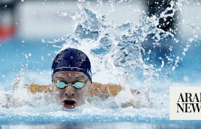 Leon Marchand captures 4th Olympic swimming gold, setting off a party across Paris