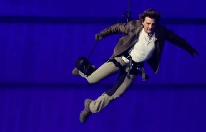 Tom Cruise abseils off stadium roof in daring Olympic finale