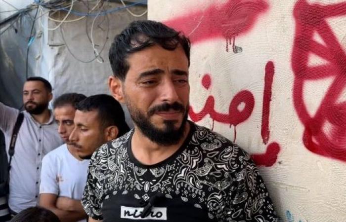 Parents recall children dying in their arms after Israeli strike kills 30 in central Gaza