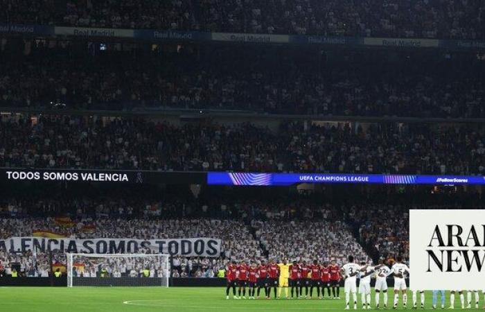 Real Madrid and AC Milan pay tribute to victims of deadly Valencia floods in Champions League match