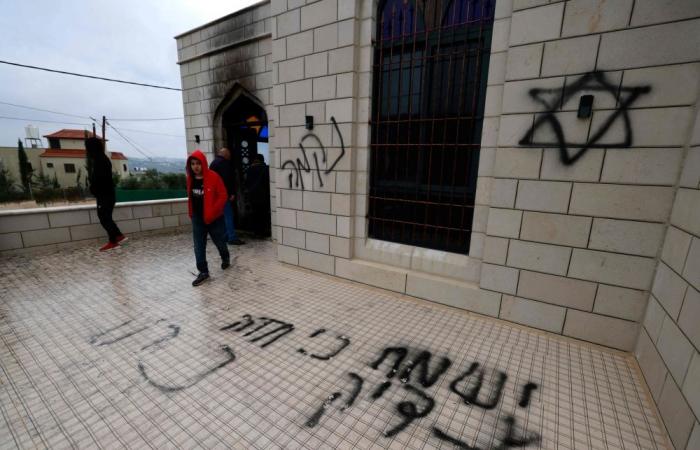 Palestinians accuse Israeli settlers of arson and hate slogans spray-painted on walls at West Bank mosque