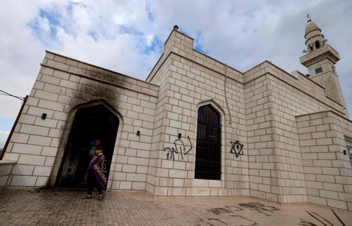 Palestinians accuse Israeli settlers of arson and hate slogans spray-painted on walls at West Bank mosque