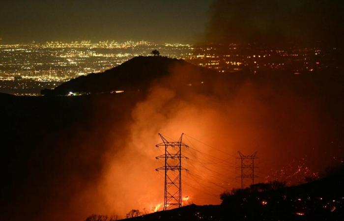 Firefighters race to beat LA blazes as winds grow and death toll hits 16