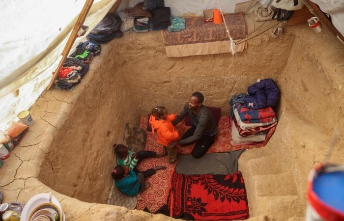 A Gaza father’s struggle to survive winter in a hole dug by hand for his family