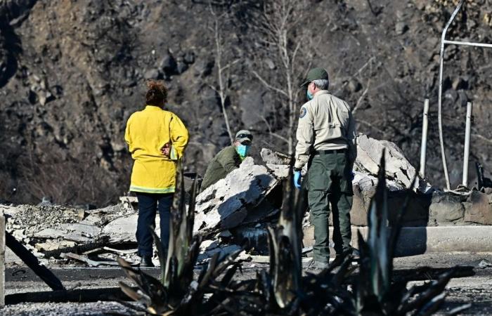 Mounted police comb fire-charred Los Angeles for bodies