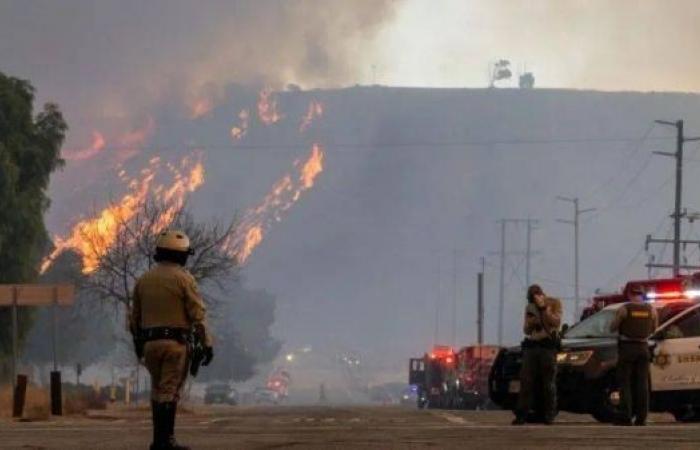 Thousands evacuated as new fast-growing fire ignites near Los Angeles