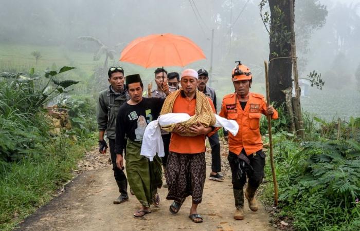 Indonesia landslide death toll rises to 21 as rescuers dig for survivors