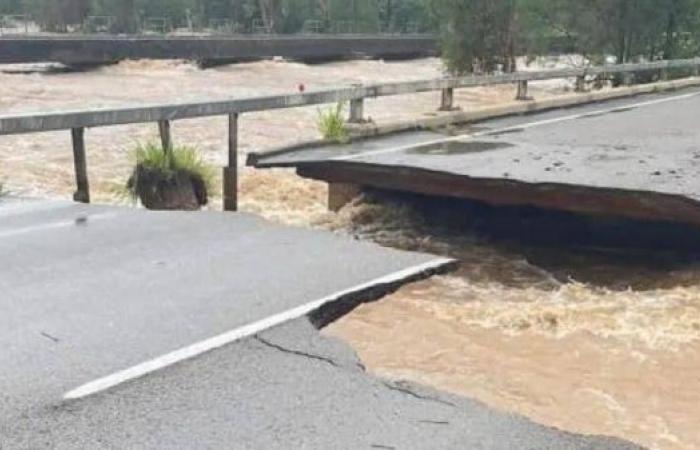 Major highway partly collapses as Australian floods worsen