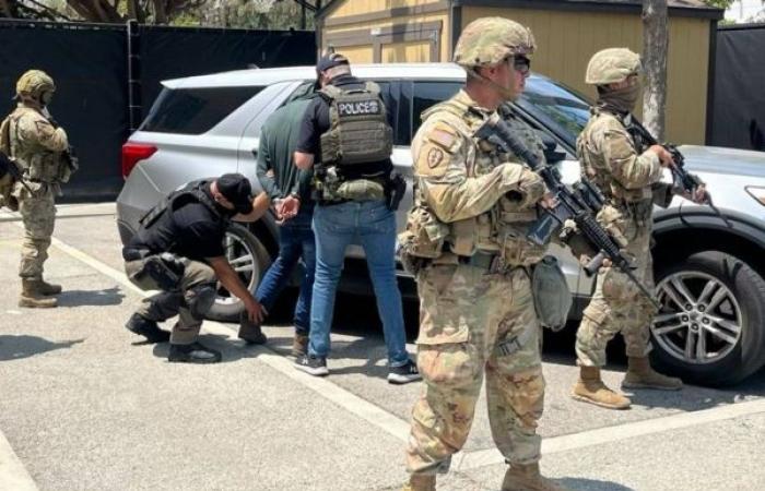 LA police enforce curfew as Trump vows to 'liberate' city