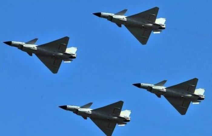 China sends dozens of planes across central line in Taiwan Strait