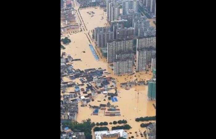 China floods force 80,000 to flee; Guizhou football field buried under three metres of water (VIDEO)