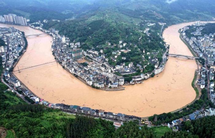 Six dead as floodwaters from upstream swamp China’s Guangxi, cyclone looms