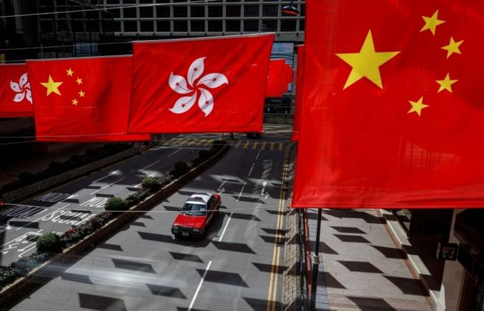 Drunk passenger nabbed for knifing Hong Kong taxi driver after being woken at stop