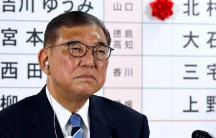 Japan's PM vows to stay on despite bruising election loss