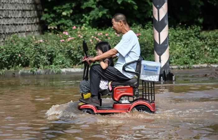 China villagers clean up after ‘once in a hundred years’ flood