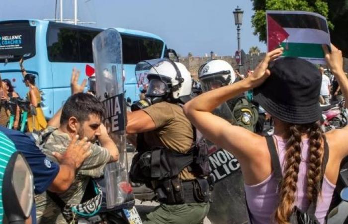 Riot police scuffle with anti-war demonstrators on Rhodes during visit by Israeli cruise ship