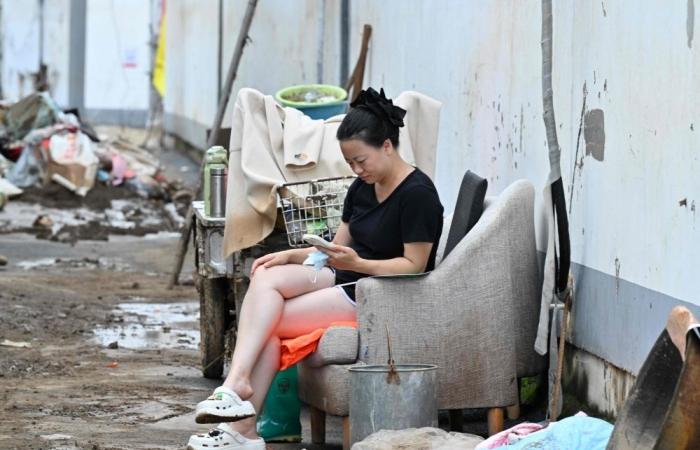 Beijing lifts red rain alert but warns of floods, landslides after evacuating over 82,000