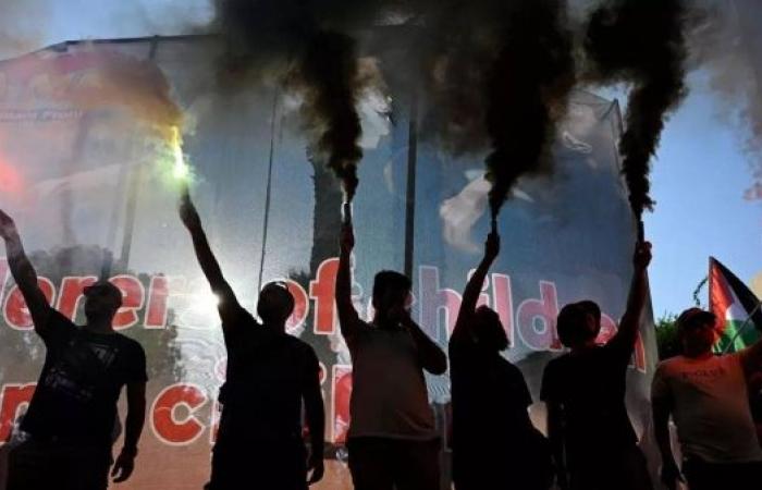 Riot police block pro-Palestine protesters from approaching Israeli cruise ship in Greece