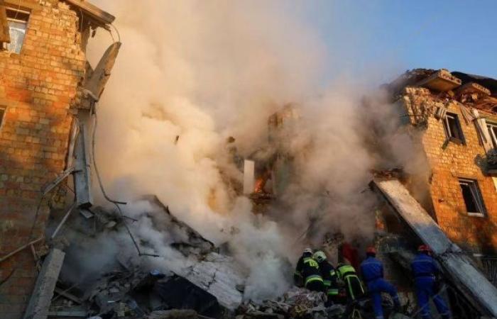 Rescuers race to reach victims as Russian strikes pound Kyiv, killing at least 12