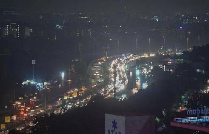 Eight-hour traffic jams in Delhi suburb as rains wreak havoc