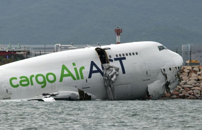 Cargo plane skids off runway into sea at Hong Kong airport, killing two in patrol vehicle, flights unaffected