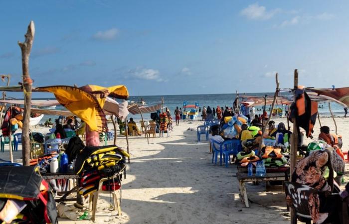 What draws travellers to Mogadishu despite Al-Shabaab threats and Western advisories?