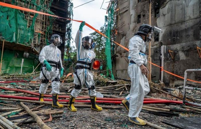 Hong Kong scrambles to remove scaffolding nets after deadly fire; contractors to foot bill 