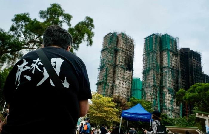 Hong Kong scrambles to remove scaffolding nets after deadly fire; contractors to foot bill 