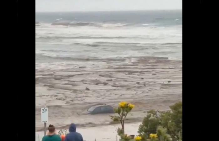 Cars swept into sea as floods cut off Great Ocean Road; bushfires ravage Victoria