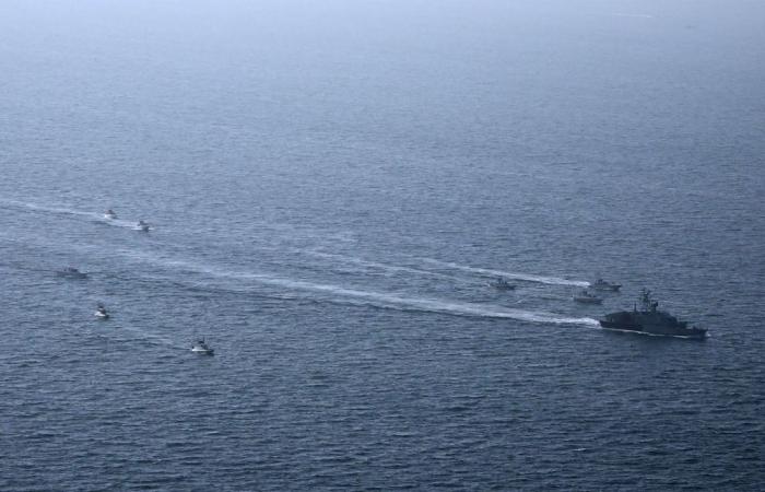 US warship surge puts Iran strike option on table