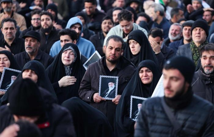 Iran divided: As some mourners weep in Tehran, others topple statues and dance in streets