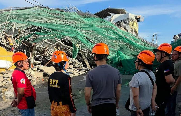 Two trapped people alive after Philippines building collapse, rescue continues