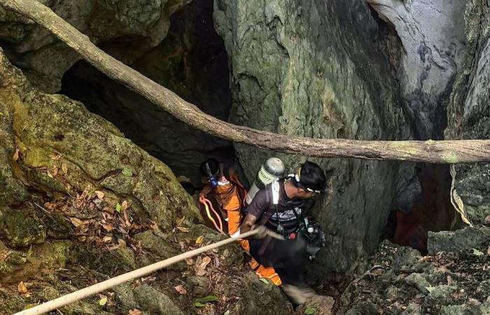 Rescuers find five out of seven people trapped in Laos cave alive, safe
