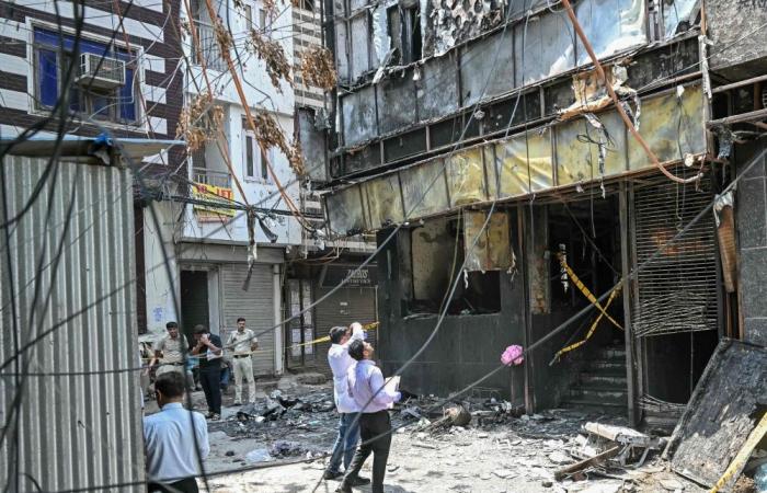 Eighteen foreign nationals among 21 killed in Delhi hotel fire, witnesses describe people jumping to escape flames