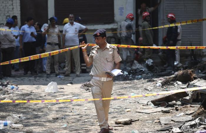Eighteen foreign nationals among 21 killed in Delhi hotel fire, witnesses describe people jumping to escape flames